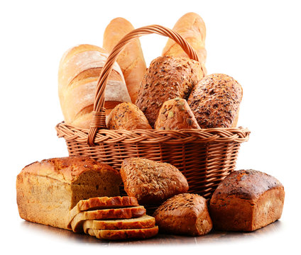 Wicker basket with assorted baking products isolated on white