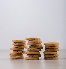 Chocolate cookies on wooden table. Cookies with chocolate and nuts
