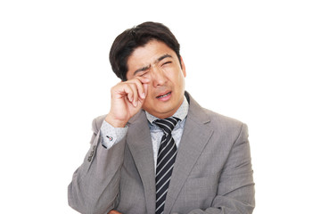 悲しむビジネスマン
