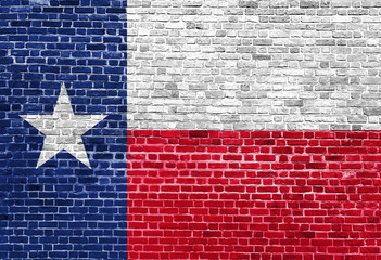 Texas US flag painted on old vintage brick wall