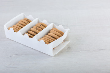 Chocolate cookies on wooden table. 