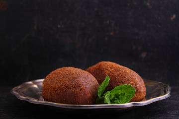 potato cake on the plate on a black background. Russian kitchen.