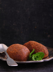 potato cake on the plate on a black background. Russian kitchen.