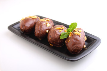 potato cake in a black plate on a white background. Russian kitchen