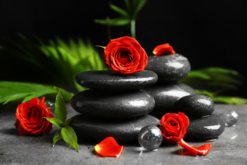 Beautiful spa composition with roses and stones