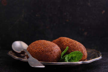 potato cake on the plate on a black background. Russian kitchen.