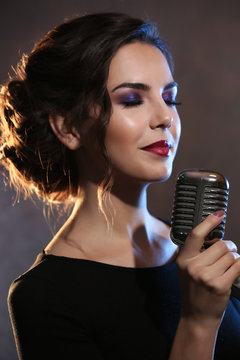 Portrait of beautiful singing woman, close up