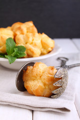 eclair cake in a plate on a black background