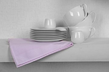 Tableware with napkin on a white background