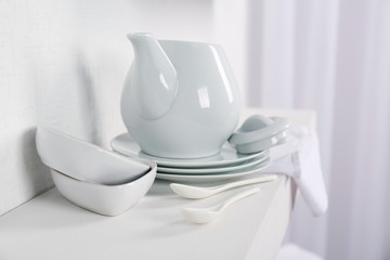 Tableware with napkin on a white background, close up