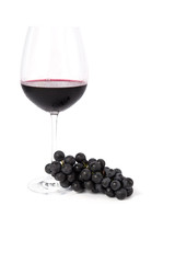 Bunch of grapes and glass of red wine