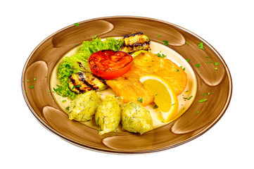 Perch fillet fish, breaded vegetables, tomatoes, zucchini and potato