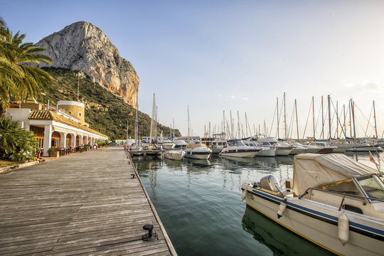 Calpe Alicante marina boats with Penon de Ifach mountain.