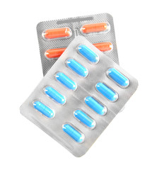 Varicolored pills in the blister pack, isolated on white