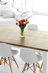 Beautiful comfortable modern interior with table and chairs