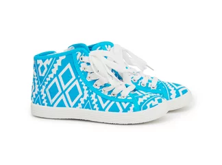 Outdoor-Kissen Sports sneakers in blue thick fabric. Presented on a white backg © cocooo