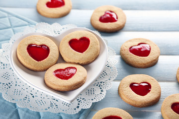 Assortment of love cookies on blue wooden table background