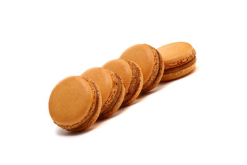 A few macarons are isolated on white