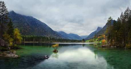 Misty summer morning on the Hintersee lake in Austrian Alps.