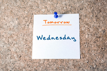 Wednesday Reminder For Tomorrow On Paper Pinned On Cork Board