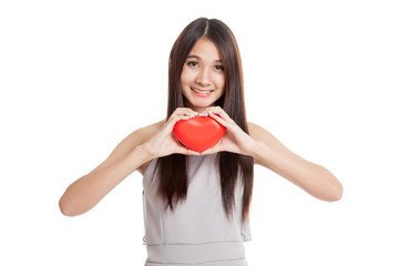 Beautiful young Asian woman with red heart