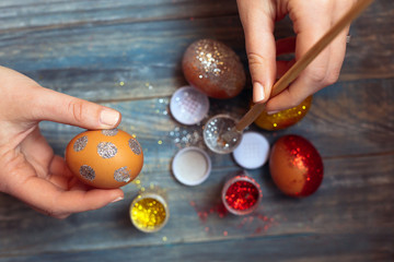 Woman Coloring Easter Eggs