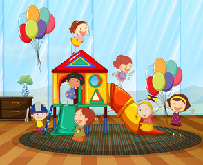 Children playing on the slide in the room