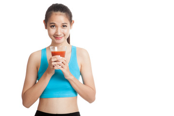 Beautiful healthy Asian girl with tomato juice