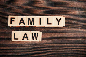 Blocks with letters regarding child-custody and family-law concept. Retro stylization