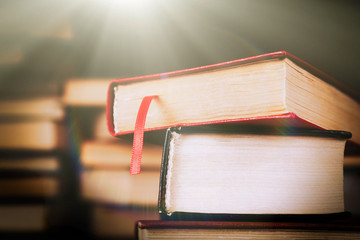 Heap of old books on table, close-up