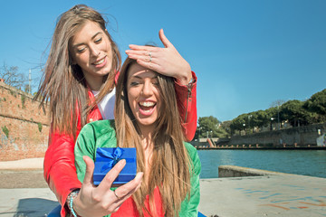 best friends forever - happy girl gets a surprise gift from her college girl friend - friendship ...