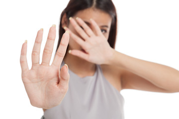 Young Asian woman  hide her  face focus at hand