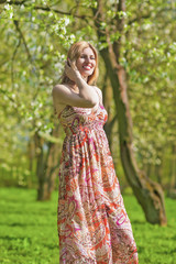 Portrait of Smiling Sensual Blond Woman in Spring Forest Outdoors