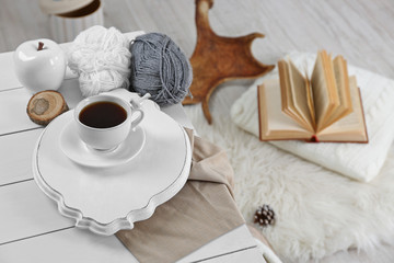 Cup of hot drink in living room. Comfortable winter weekend or holidays at home