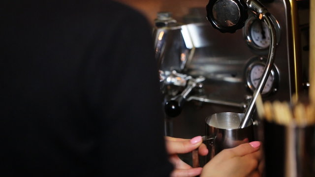  Barista Steaming Milk And Coffee In Coffeeshop