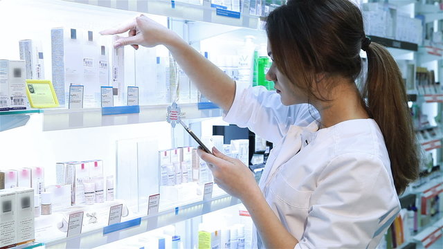 Pharmacist using a digital tablet