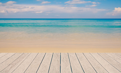 Fototapeta na wymiar wooden floor with beautiful ocean and blue sky
