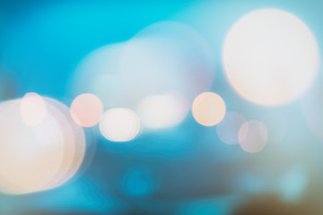 abstract background with bokeh defocused lights and shadow from christmas night party, vintage or retro color tone