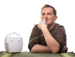 Adult man using inhalter