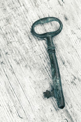 Antique key on wood