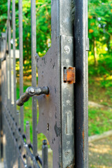 rusty lock in the old iron gate