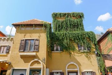 Tree covered building.