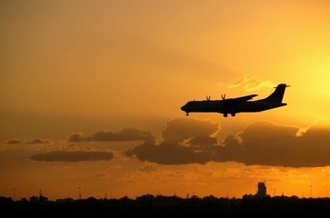 Fototapeta na wymiar Airplane on sunset