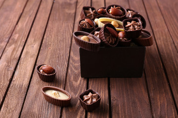 Chocolate sweets on wooden background