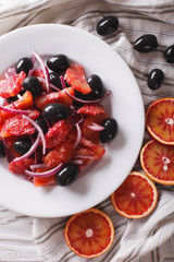 Delicious Italian salad of red orange close-up. Vertical top view 
