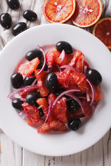Sicilian orange salad and ingredients close-up. Vertical top view 
