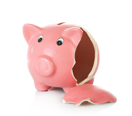 Broken piggy bank isolated on white background