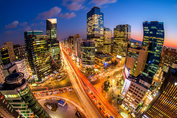 Cityscape of South Korea. Night traffic speeds through an inters