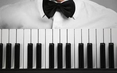 Male hands with synthesizer closeup