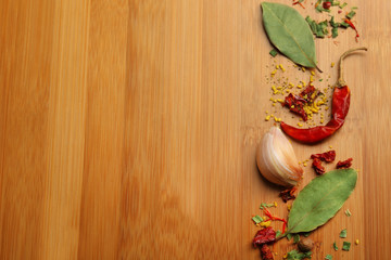 Different spices on cutting board, closeup